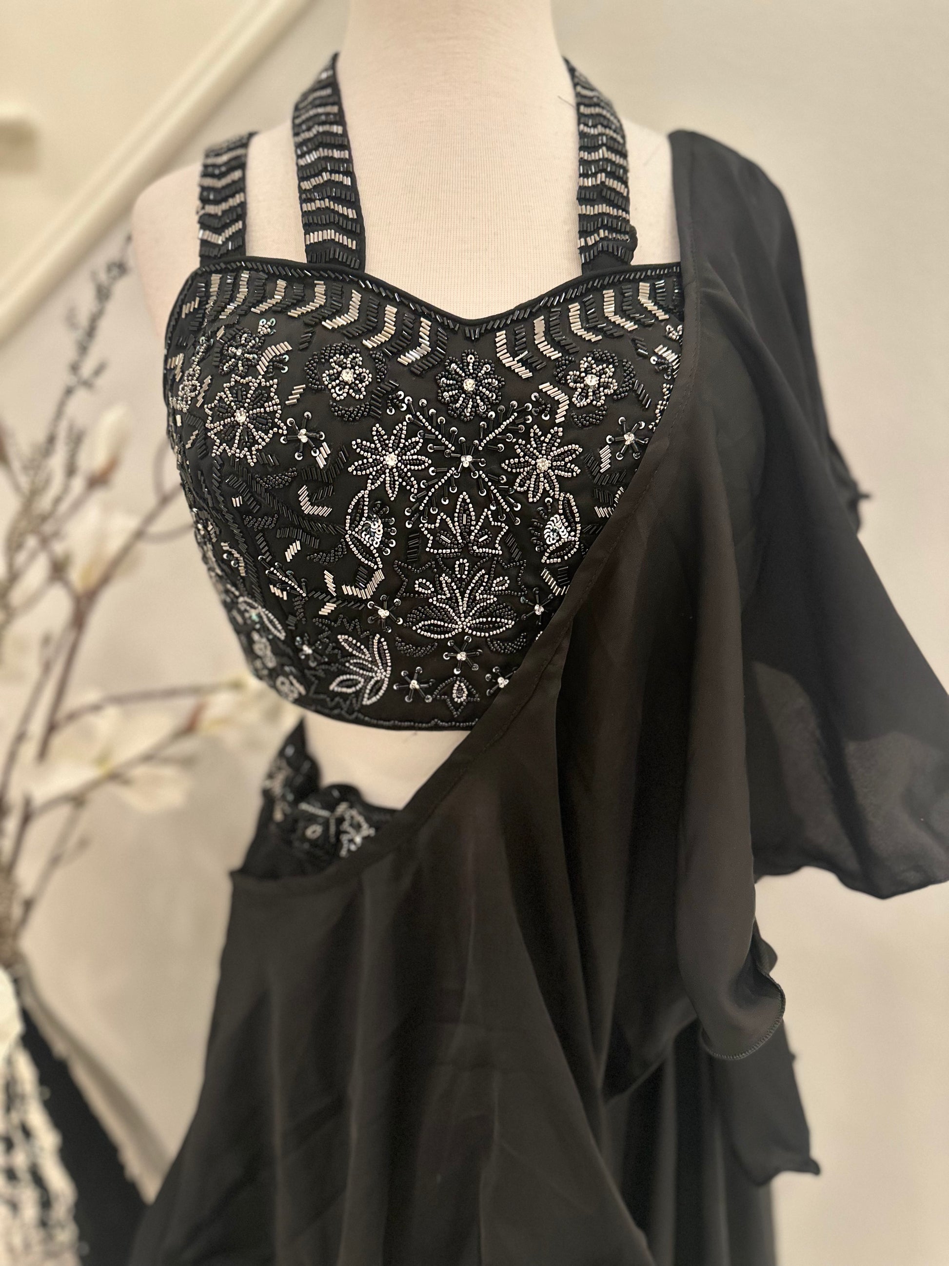 Contemporary yet stunning Palazzo set with crop-top. Top is intricately embellished with embroidered cutdana beads. Elephant bottom georgette palazzo gives this look an extra flair. Paired with a ruffled stole dupatta.

Size available: 38 with 4inch margin