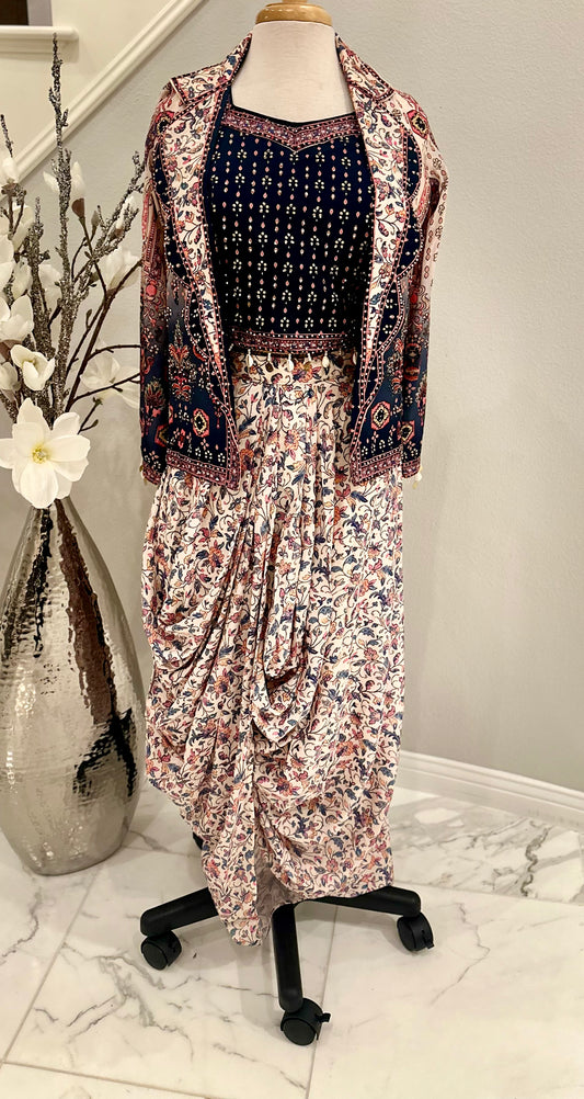 Shine bright with this beautiful 3piece ensemble in pure silk and digital floral print with rhinestone work all over.  The set includes dhoti style skirt, rhinestone embellished crop-top and jacket with front lapel

Size available 40 with margin