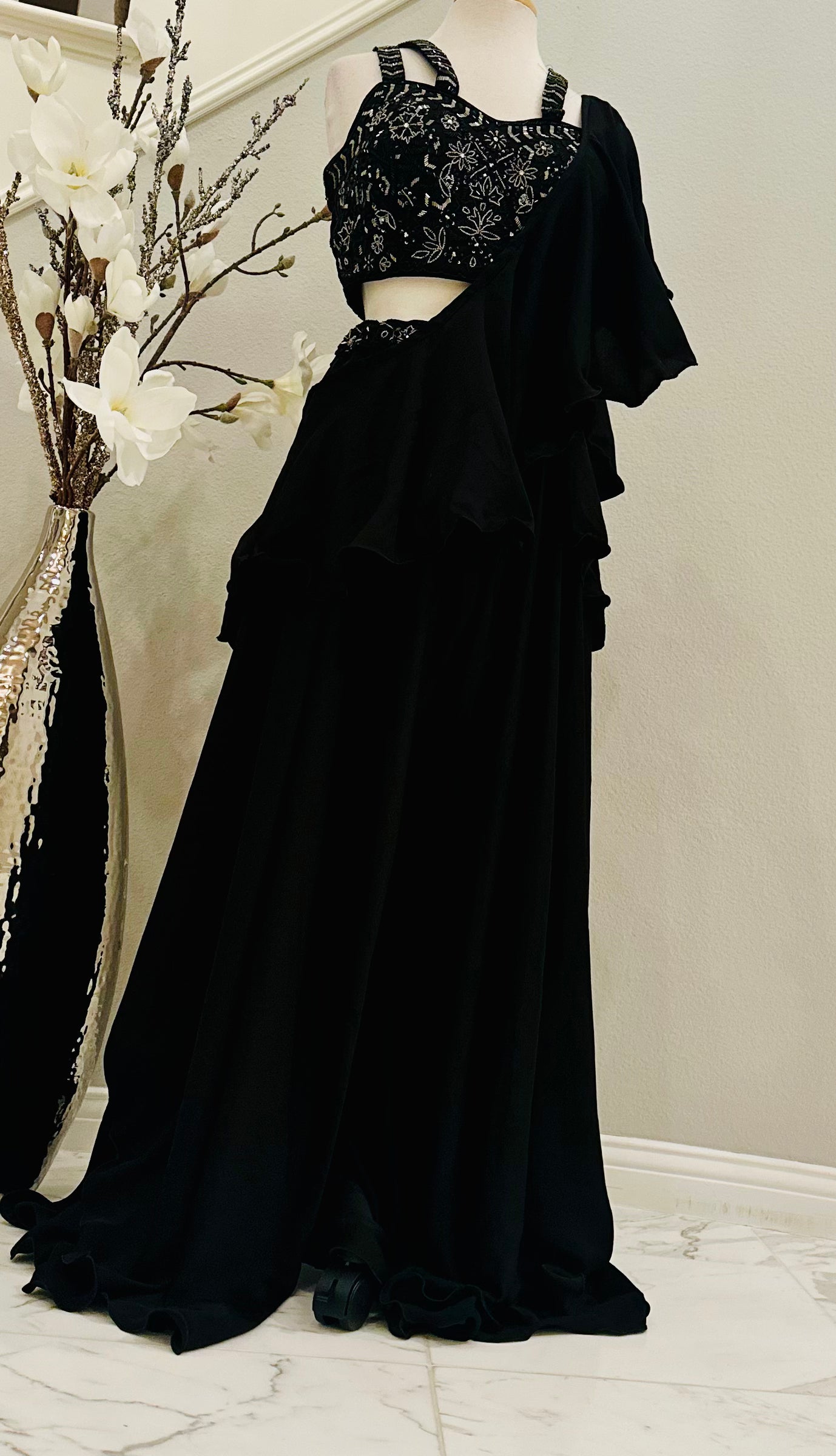 Contemporary yet stunning Palazzo set with crop-top. Top is intricately embellished with embroidered cutdana beads. Elephant bottom georgette palazzo gives this look an extra flair. Paired with a ruffled stole dupatta.

Size available: 38 with 4inch margin