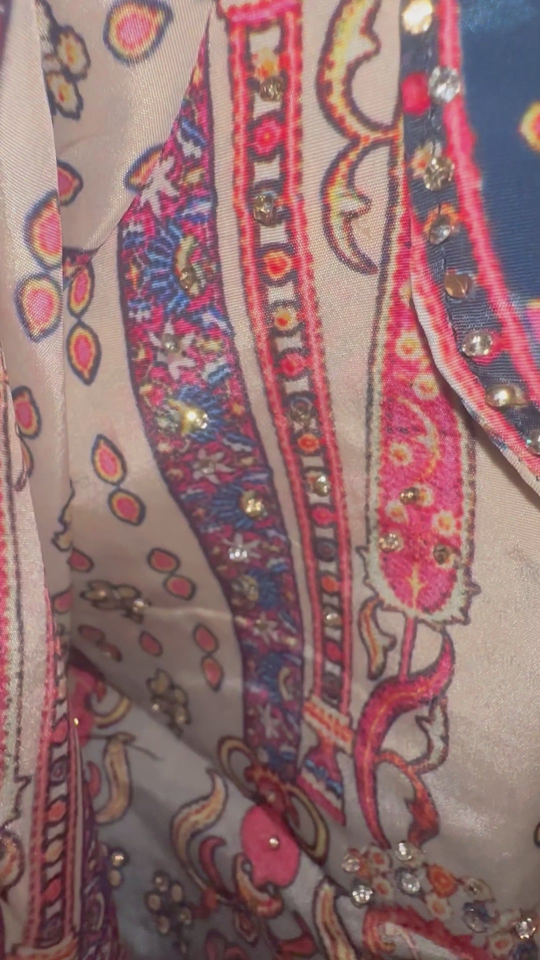 Shine bright with this beautiful 3piece ensemble in pure silk and digital floral print with rhinestone work all over.  The set includes dhoti style skirt, rhinestone embellished crop-top and jacket with front lapel

Size available 40 with margin