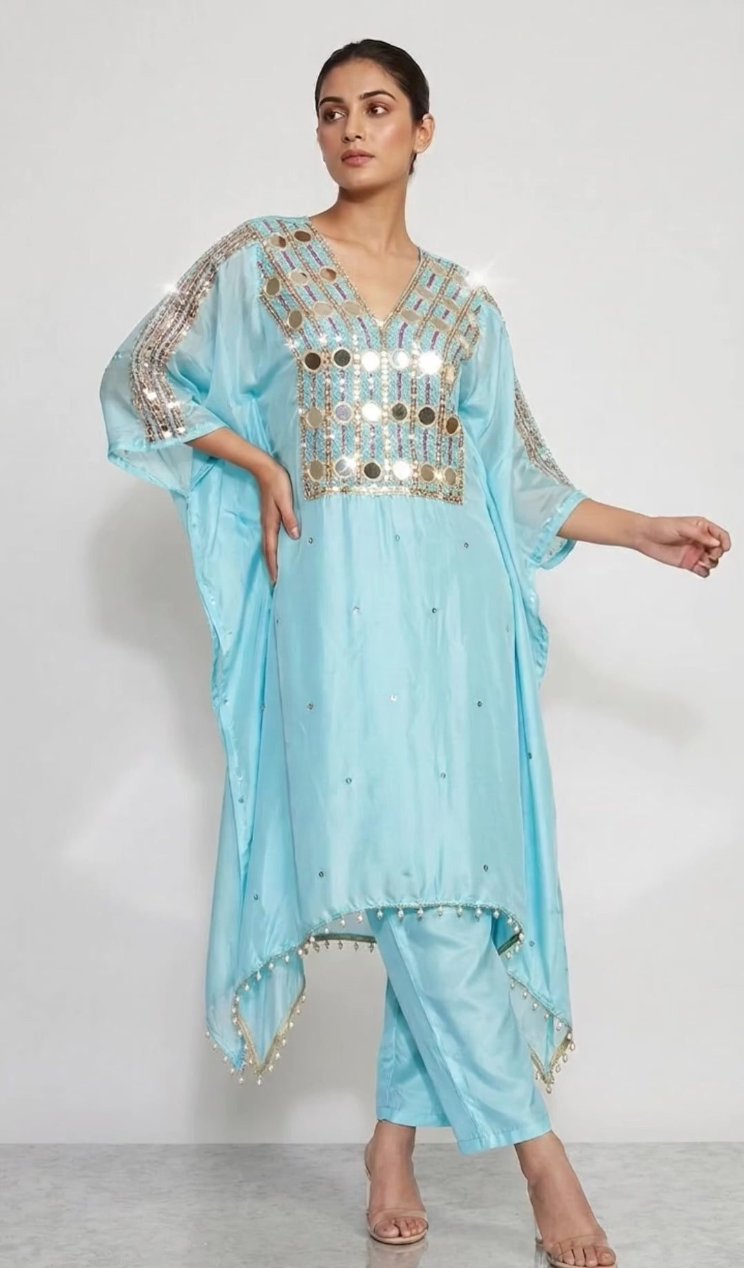 Light blue Kaftan set combines the timeless shimmer of hand-crafted mirror work, delicate beadwork, and sequins